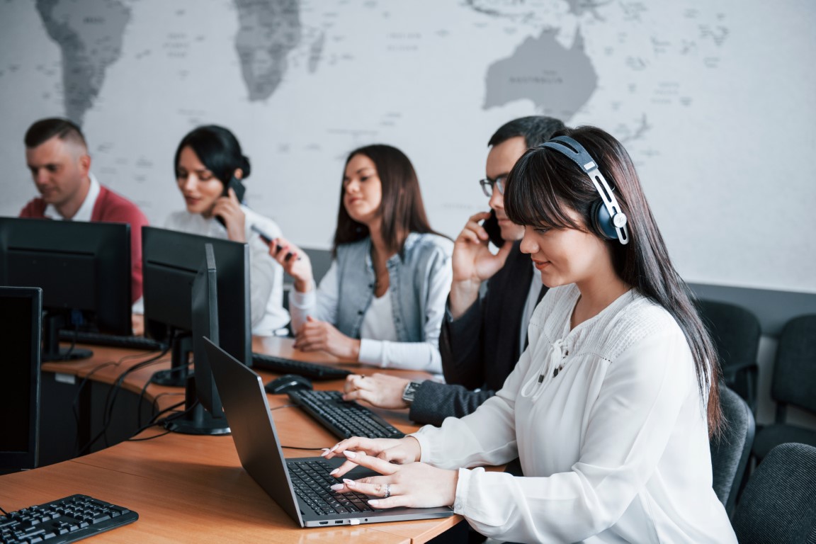 Searching information. Young people working in the call center. New deals is coming.